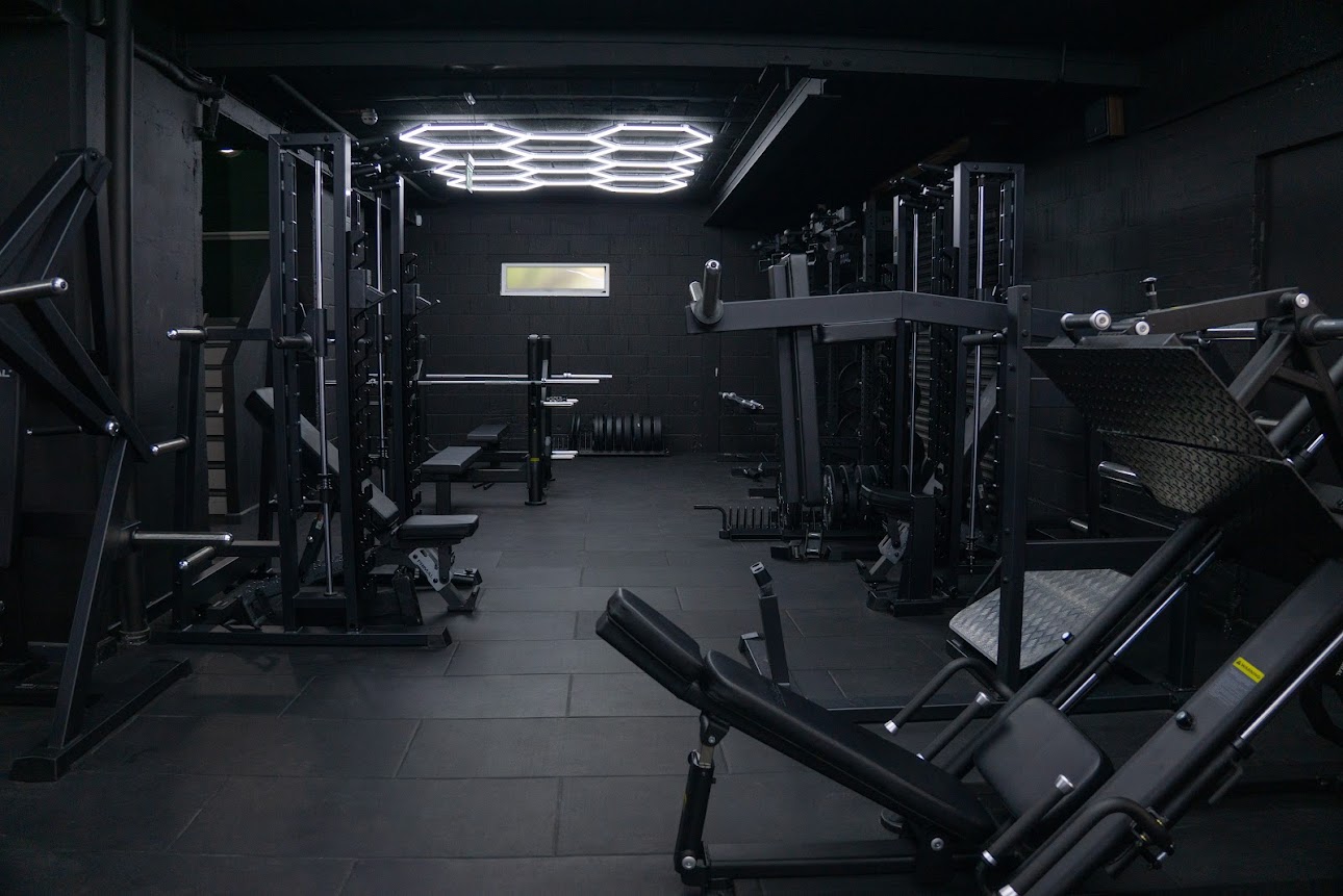 Power rack and squat station area with hexagonal ceiling lights